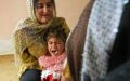 Iraqi Kurdish four-year-old Shwen screams during her circumcision in Suleimaniyah on April 14, 2009